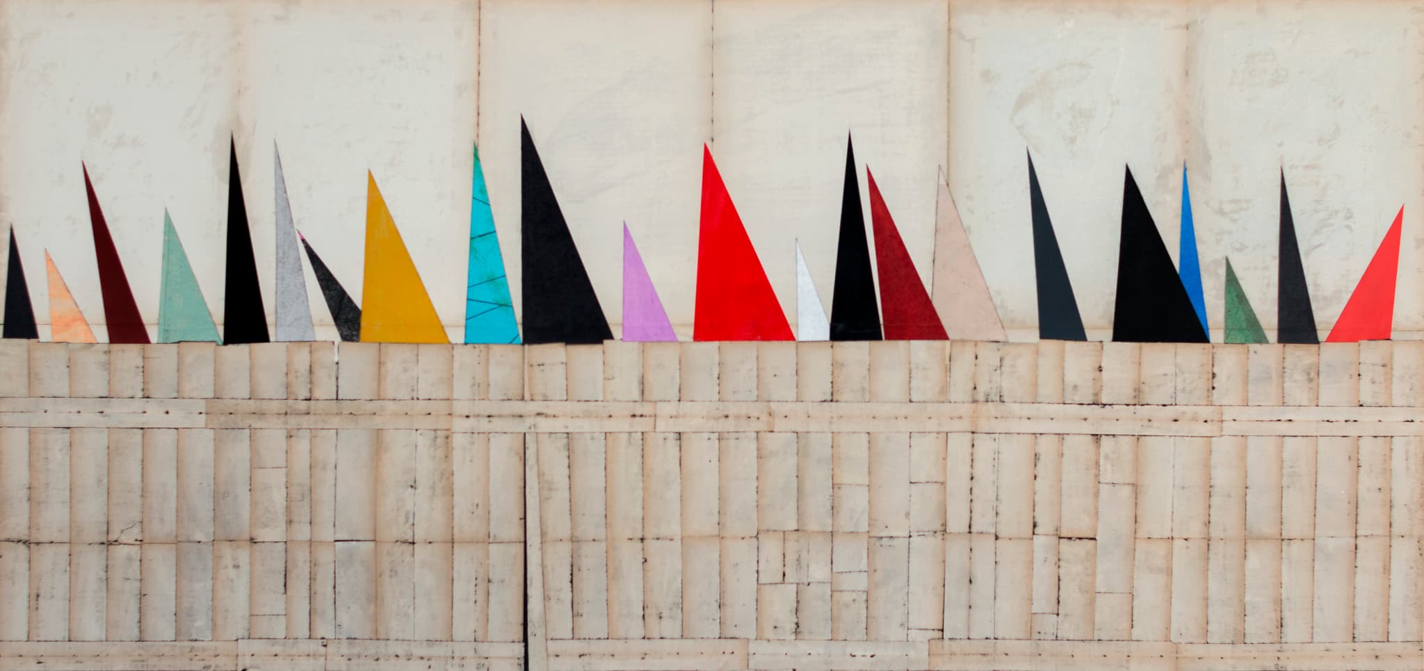 From the Series "Behind the Fence", 2016. Coloured triangles rise above a pale wall, mixed media décollage on paper, 68 × 149 cm.